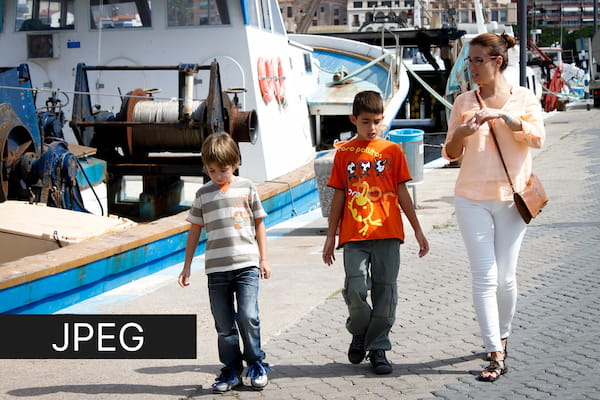 Family walking along the port